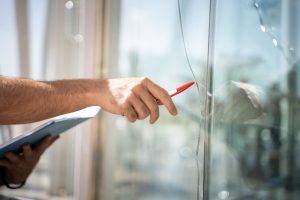 glass-broken-from-house-by-accident-man-checking-repair (1)